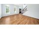 Inviting living area with hardwood floors, large windows, and freshly painted walls at 112 Sterling Ridge Way, Cary, NC 27519