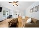 Bright living room with hardwood floors featuring a fireplace and kitchen in the background at 112 Sterling Ridge Way, Cary, NC 27519