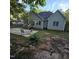 This home's backyard features a concrete patio, wooden deck, and fenced yard, creating a welcoming outdoor space at 119 Comanche Dr, Louisburg, NC 27549
