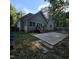 Backyard view of this home with a wooden deck, a concrete patio, and a fenced in yard for outdoor enjoyment at 119 Comanche Dr, Louisburg, NC 27549