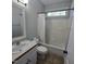 Bathroom with sink, toilet, tub and shower features neutral color palette at 119 Comanche Dr, Louisburg, NC 27549