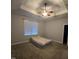 Bedroom with carpet and neutral color palette features ceiling fan and ample light at 119 Comanche Dr, Louisburg, NC 27549
