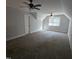 Spacious room featuring plush carpet, dual ceiling fans and a window adding natural light at 119 Comanche Dr, Louisburg, NC 27549