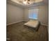 Bedroom with carpet and neutral color palette features ceiling fan at 119 Comanche Dr, Louisburg, NC 27549