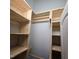 Walk-in closet with custom shelving, ample space and natural wood features at 119 Comanche Dr, Louisburg, NC 27549