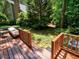 Multi-level wooden deck overlooking a serene wooded area at 119 Long Shadow Ln, Cary, NC 27518