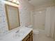 Cozy bathroom with Paris-themed wallpaper, soaking tub, and vanity at 119 Long Shadow Ln, Cary, NC 27518