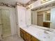 Bathroom features a dual sink vanity, decorative wallpaper, and a separate shower room at 119 Long Shadow Ln, Cary, NC 27518