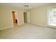 Spacious carpeted bedroom features a ceiling fan and access to closet and bathroom at 119 Long Shadow Ln, Cary, NC 27518
