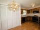 Kitchen with wood cabinets, appliances and a pendant light fixture at 119 Long Shadow Ln, Cary, NC 27518