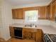 Well-lit kitchen with stainless steel sink and neutral countertop at 119 Long Shadow Ln, Cary, NC 27518
