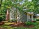 Well-maintained exterior with a brick chimney and lush landscaping at 119 Long Shadow Ln, Cary, NC 27518