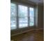 Bedroom showcasing large windows that allow ample sunlight to illuminate the space at 12 Crail Ct, Durham, NC 27712