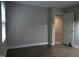 Bedroom featuring dark wood flooring, neutral walls, and a view into the doorway at 12 Crail Ct, Durham, NC 27712
