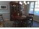 Dining room with hardwood table, chairs, hutch and decor at 12 Crail Ct, Durham, NC 27712