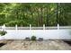 Well kept backyard with privacy fence, greenery and low maintenance paved patio at 120 Jennel Way, Durham, NC 27707