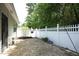 Outdoor patio with a white picket fence and landscaped garden at 120 Jennel Way, Durham, NC 27707