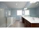 Bathroom with glass enclosed shower, separate tub, double sink vanity and tile floors at 120 Jennel Way, Durham, NC 27707