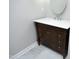 Bathroom featuring tile flooring, a vanity sink with a white countertop and dark wood cabinetry at 120 Jennel Way, Durham, NC 27707