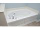 Close up of bathroom tub with white base and chrome hardware at 120 Jennel Way, Durham, NC 27707