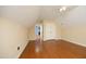 Bedroom with hardwood floors, closet, access to other rooms and a ceiling fan at 120 Jennel Way, Durham, NC 27707
