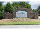 Stone sign for Glenview Park with flowerbed and manicured landscaping against lush trees, inviting residents and visitors alike at 120 Jennel Way, Durham, NC 27707
