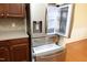 Stainless steel refrigerator with a water dispenser and pull-out freezer drawer at 120 Jennel Way, Durham, NC 27707