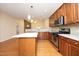 Beautiful kitchen with an island, stainless steel appliances and wooden cabinets at 120 Jennel Way, Durham, NC 27707