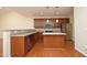 Kitchen featuring stainless steel appliances, a kitchen island and hardwood floors at 120 Jennel Way, Durham, NC 27707