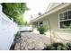 Outdoor patio with brick pavers, privacy fence, and tasteful landscaping at 120 Jennel Way, Durham, NC 27707