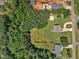 Bird's eye view shows this home with a basketball court, soccer goal and expansive yard at 123 Scheer Ave, Durham, NC 27703