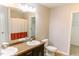Bright bathroom features a double vanity with granite countertop and walk-in closet at 123 Scheer Ave, Durham, NC 27703