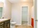 Bright bathroom features a single vanity with a granite countertop and a walk-in closet at 123 Scheer Ave, Durham, NC 27703