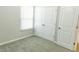 Bedroom with double-door closet, large window and neutral carpet at 123 Scheer Ave, Durham, NC 27703