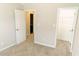 Bedroom with ensuite bathroom and walk-in closet, neutral walls and carpet at 123 Scheer Ave, Durham, NC 27703