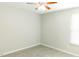 Neutral bedroom with a ceiling fan and a large, bright window at 123 Scheer Ave, Durham, NC 27703