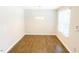 Empty dining room area with laminate flooring, and neutral paint at 123 Scheer Ave, Durham, NC 27703