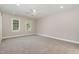 Spacious bedroom with neutral carpet, ceiling fan, trim and natural light at 124 Cypress View Way, Apex, NC 27502