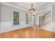 Dining room with hardwood floors, detailed molding, and bright natural light at 124 Cypress View Way, Apex, NC 27502
