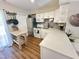 Bright kitchen with stainless steel appliances, white cabinets, and butcher block island at 129 Friar Ln, Carrboro, NC 27510