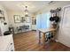 Bright kitchen and dining area with white cabinets, stainless appliances, and backyard access at 129 Friar Ln, Carrboro, NC 27510