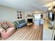 Inviting living room with fireplace, stylish furnishings, and warm, wood-look flooring at 129 Friar Ln, Carrboro, NC 27510