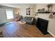 Charming living room featuring a cozy fireplace, comfortable seating, and inviting decor at 129 Friar Ln, Carrboro, NC 27510