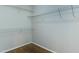 Walk-in closet featuring hardwood floors and wire shelving at 1310 Southgate Dr, Raleigh, NC 27610
