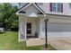 Inviting front porch with decorative lamp post and well-manicured lawn at 1310 Southgate Dr, Raleigh, NC 27610