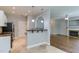 Modern kitchen featuring white cabinets, granite countertops, and stainless steel appliances at 1310 Southgate Dr, Raleigh, NC 27610