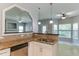 Kitchen features granite counters, a stainless dishwasher and an open view to the living room at 1310 Southgate Dr, Raleigh, NC 27610