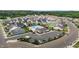 Community pool area featuring a swimming pool, playground and nearby parking at 137 Campaign Dr, Mebane, NC 27302