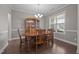 Elegant dining room perfect for entertaining with lots of natural light and chandelier at 137 Campaign Dr, Mebane, NC 27302