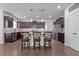 Well-equipped kitchen with stylish seating, stainless steel appliances, and ample storage at 137 Campaign Dr, Mebane, NC 27302